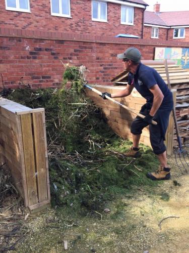 turning compost heap